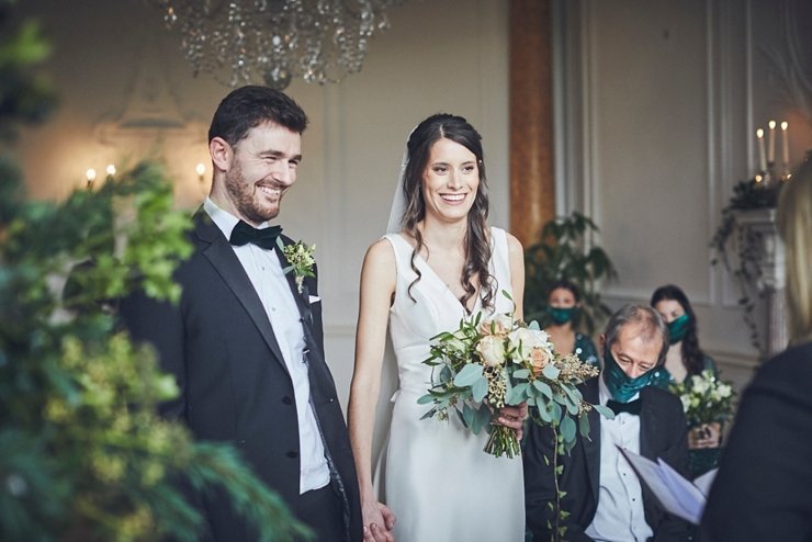 wedding photography of bride and groom smiling at small wedding at Rockbeare manor in Devon