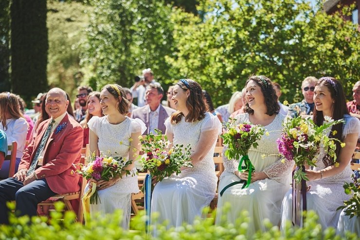 bridesmaids in white dresses with flowers 